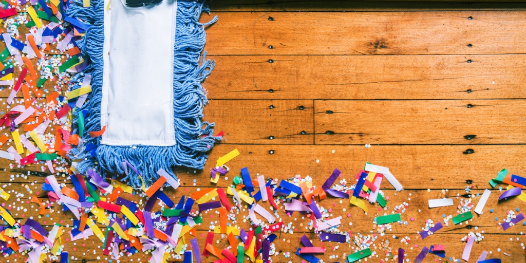 Cleaning confetti with broom